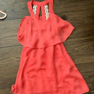 A red dress size 7 with lace and ruffles.